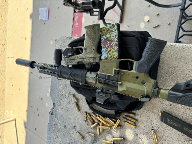 Suppressed OD green AR pistol — range day with graffiti-wrap mag