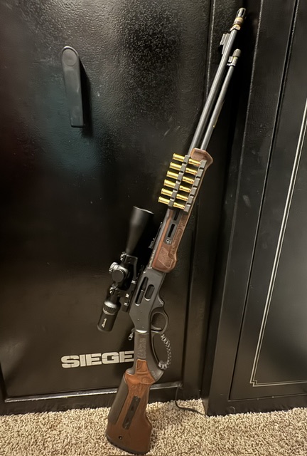 Lever-action rifle — scoped with shell holder and weapon light